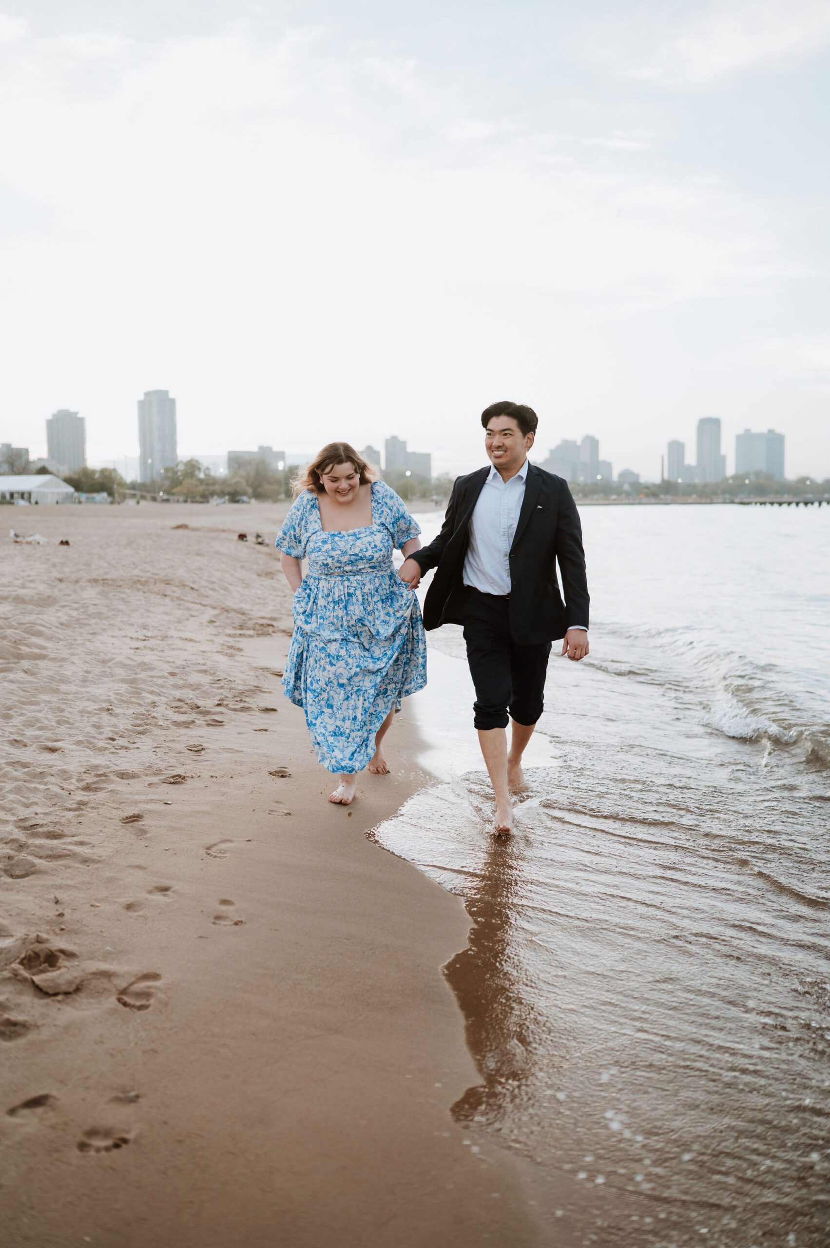 Engagement photos at North Avenue Beach Chicago skyline background