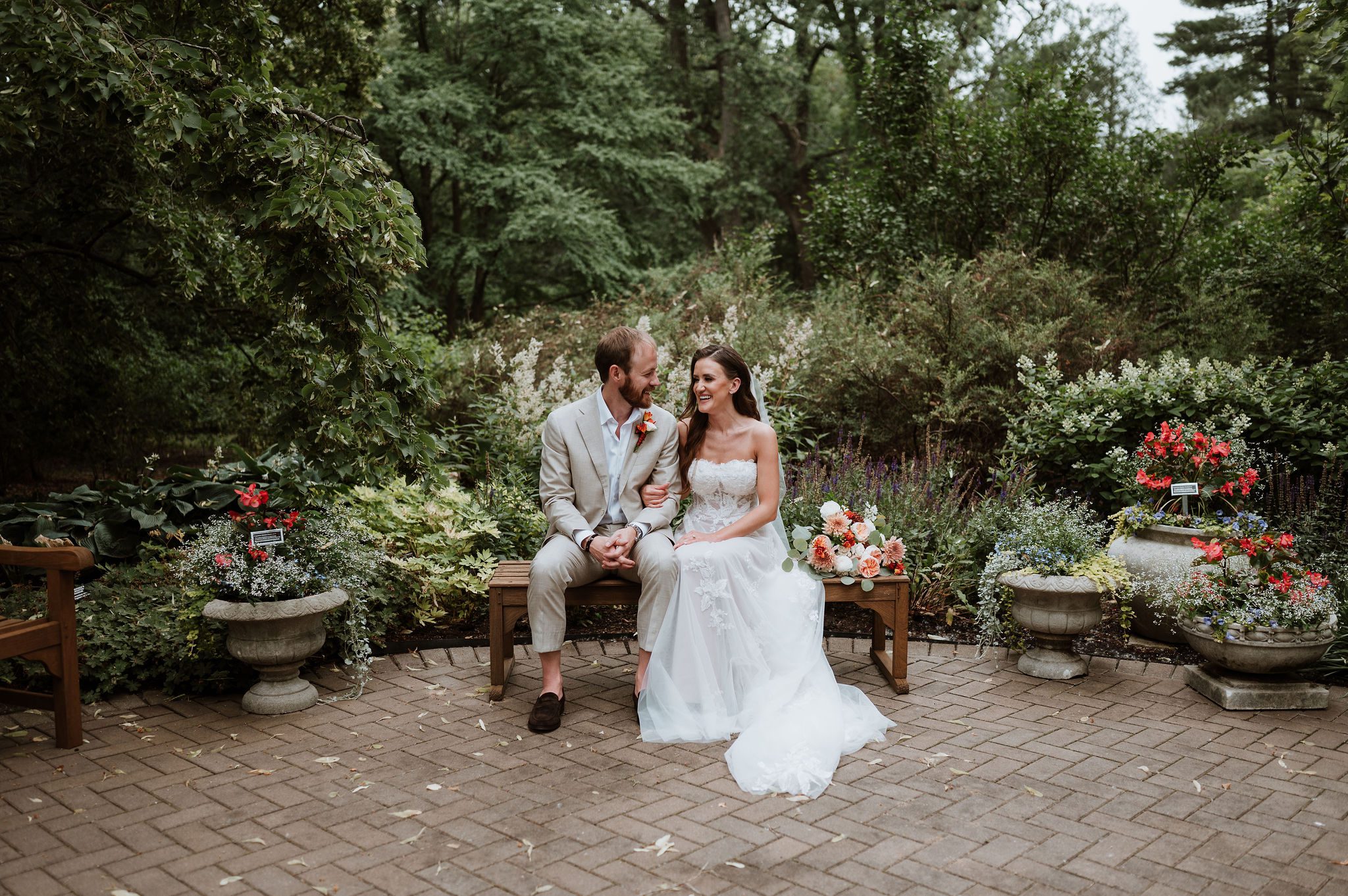 Couple portraits at Morton Arboretum surrounded by trees and open fields