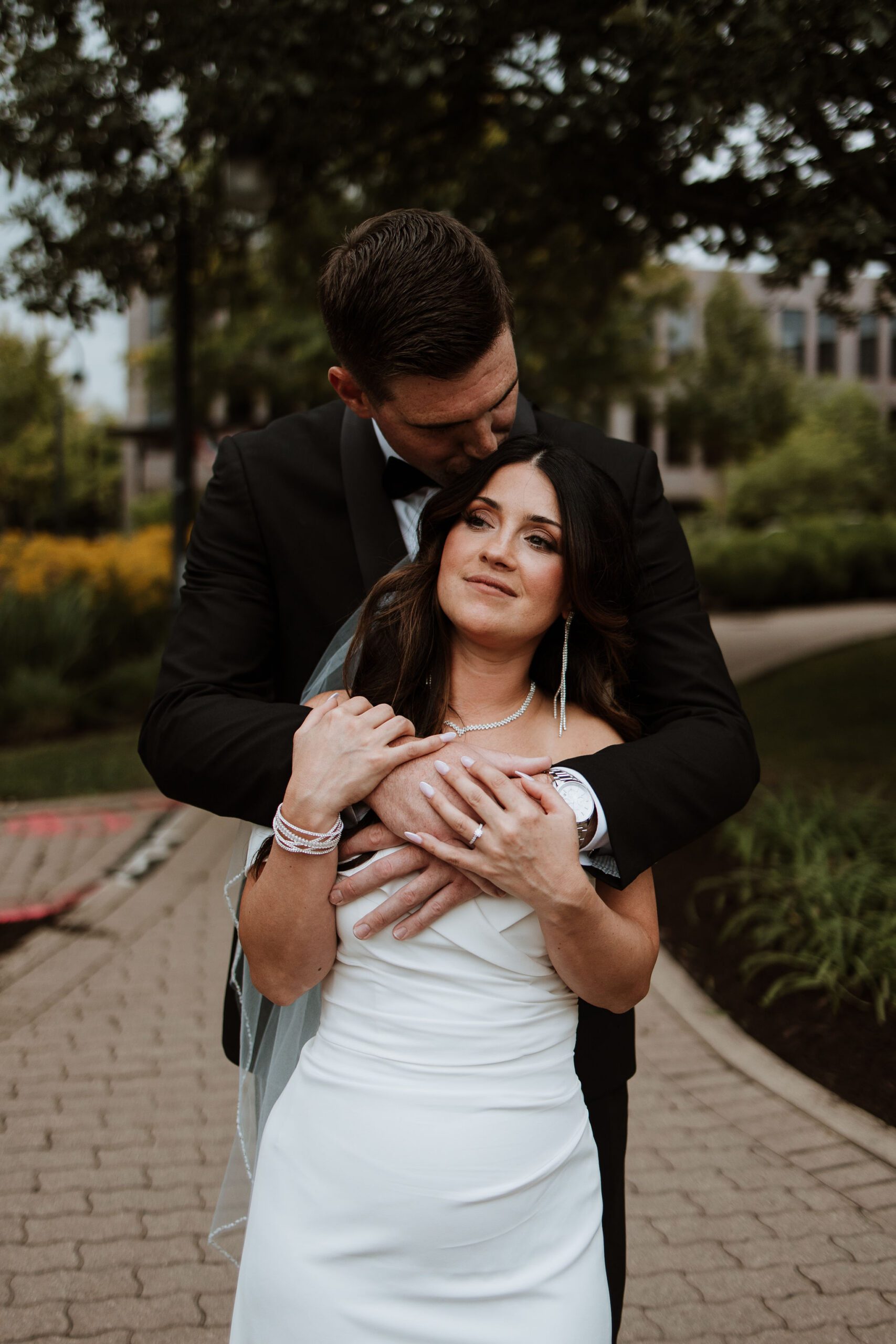 Couple portraits at Naperville Riverwalk with bridges and paths