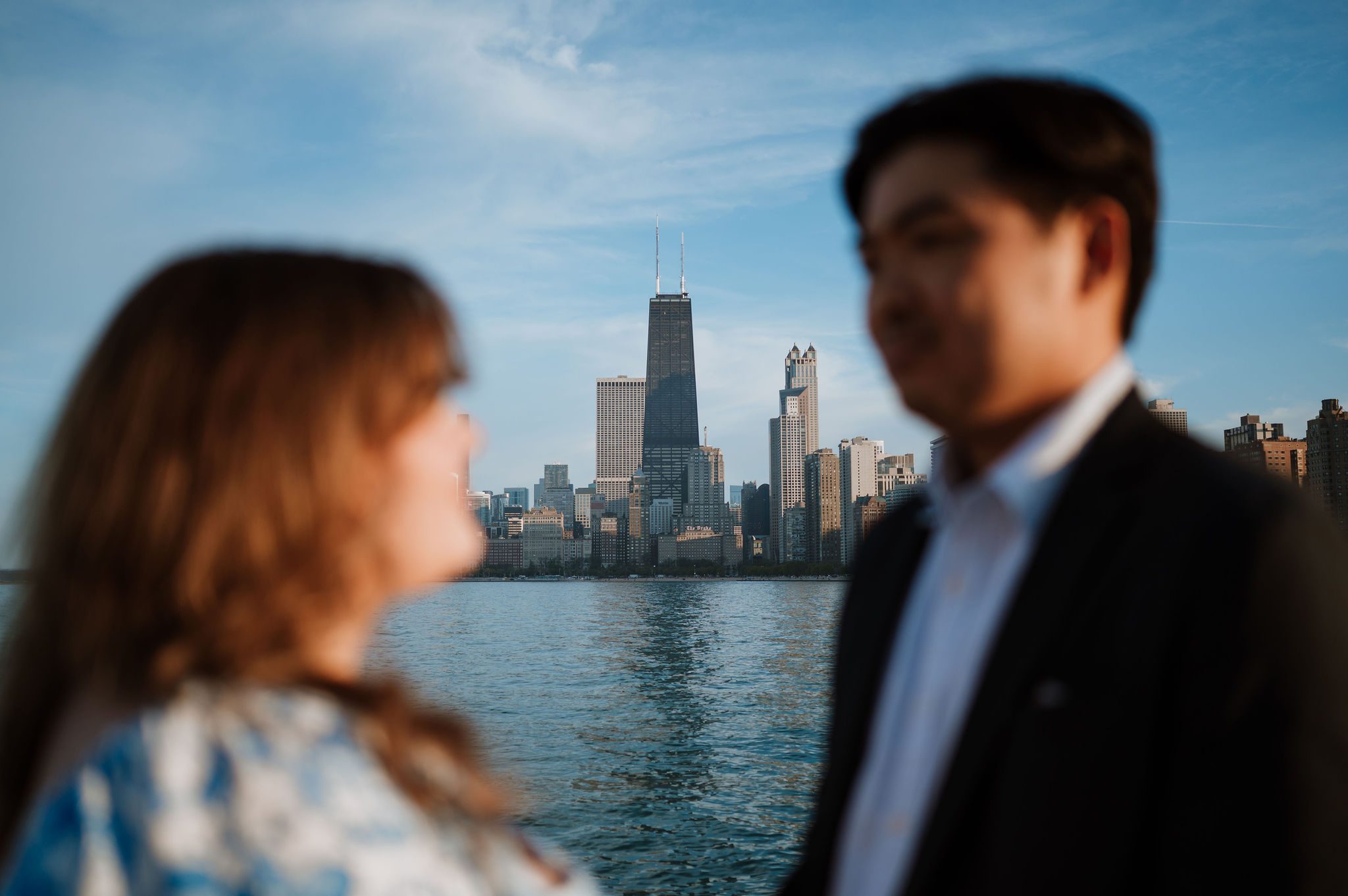 Engagement photos at North Avenue Beach Chicago skyline background
